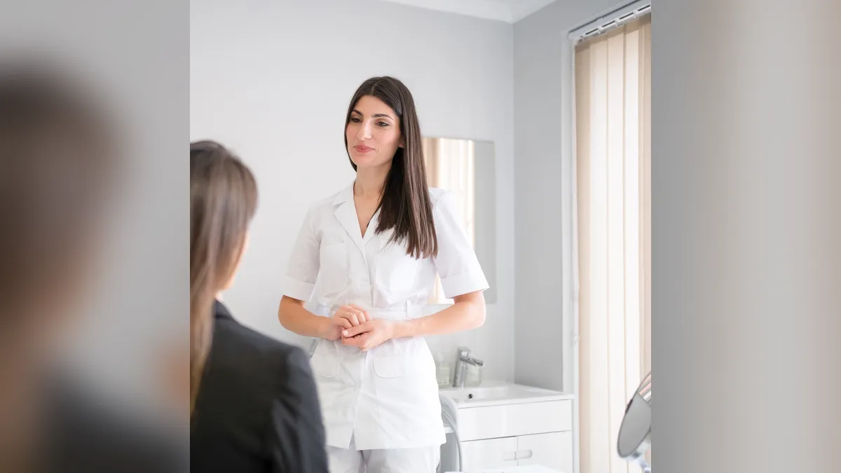 A Healthy Weight Loss 4 U clinician talking with a patient during a consultation